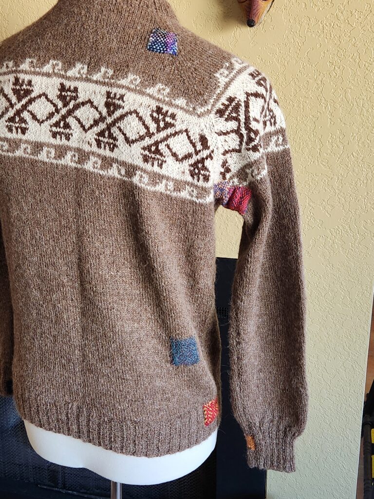 visible mending. up-cycling, alpaca wool